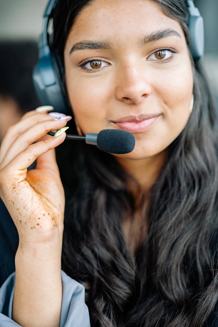 a woman wearing black headset 8867206